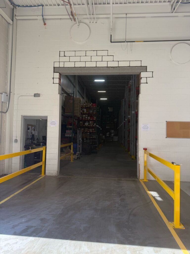 Rebuilt block and new lintel over a warehouse opening, finished and pointed